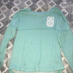 A blue green owl shirt